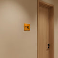 Приклад розміщення тактильної таблички з номером кабінету «132» та шрифтом Брайля на стіні біля дверей - Photo #7