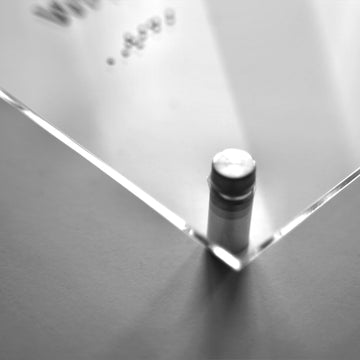 a close up of a metal surface with a bottle on it - Photo #9