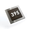 a square sign with the number "395" displayed on it. - Photo #6