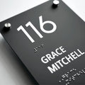 a close up of a sign on a table - Photo #6