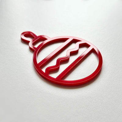 A red ornament with a wavy pattern is shown against a white background.