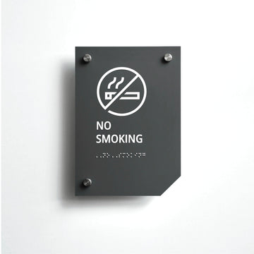 a no smoking sign on a white wall - Photo #1