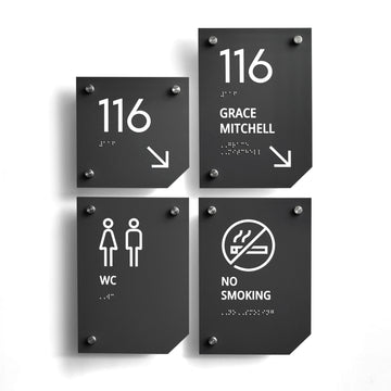 a set of four signs on a white wall - Photo #11