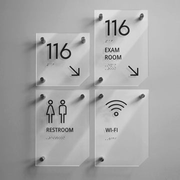 a set of four glass signs on a wall - Photo #6