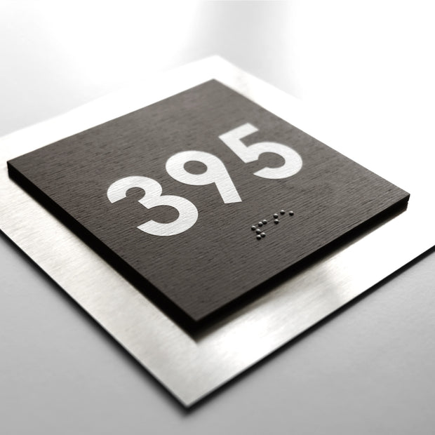 A black square sign with the number "395" printed on it.