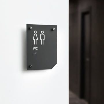 a black and white bathroom sign on a white wall - Photo #12