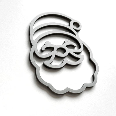 A stylized silhouette of a smiling face, resembling a cartoon or holiday-themed character, is shown against a plain white background.