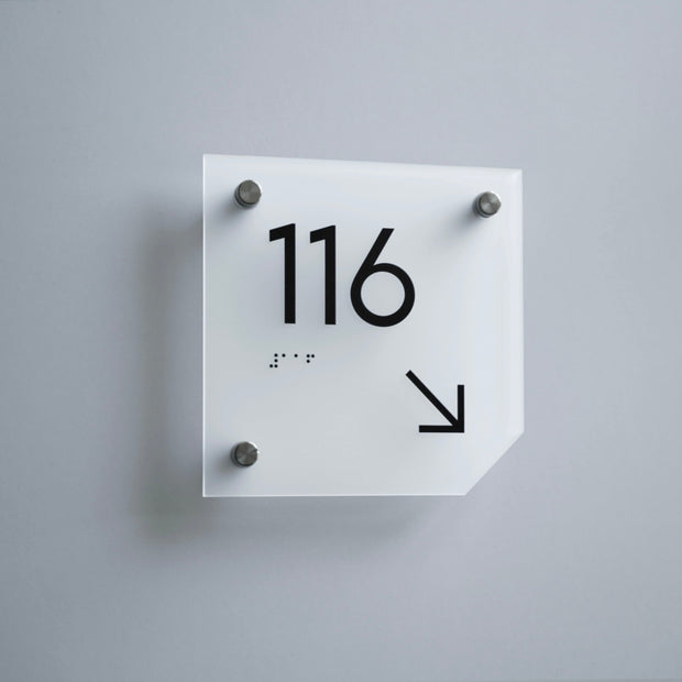 a square white clock with black numbers on it