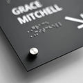 a close up of a black sign with white lettering - Photo #7