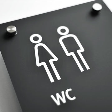 a black and white sign with a picture of a man and a woman - Photo #10