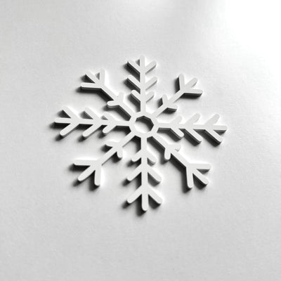 A white snowflake-shaped object is centered against a plain white background.