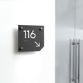 a black and white sign on a white wall - Photo #11