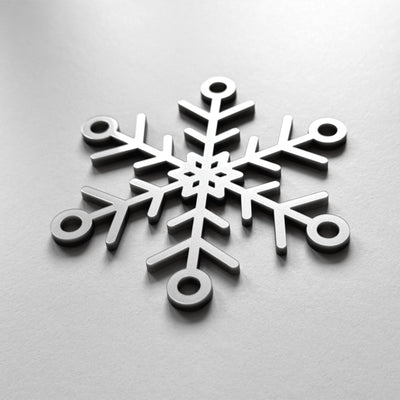 A close-up image of a snowflake-shaped object, which appears to be made of metal or a similar material.