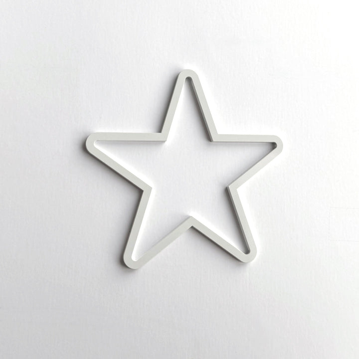 A white star-shaped object is centered against a plain white background.