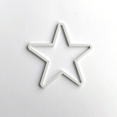 A white star-shaped object is centered against a plain white background.