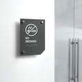 a no smoking sign on a white wall - Photo #12