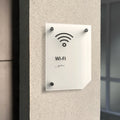 a white sign mounted to the side of a building - Photo #9