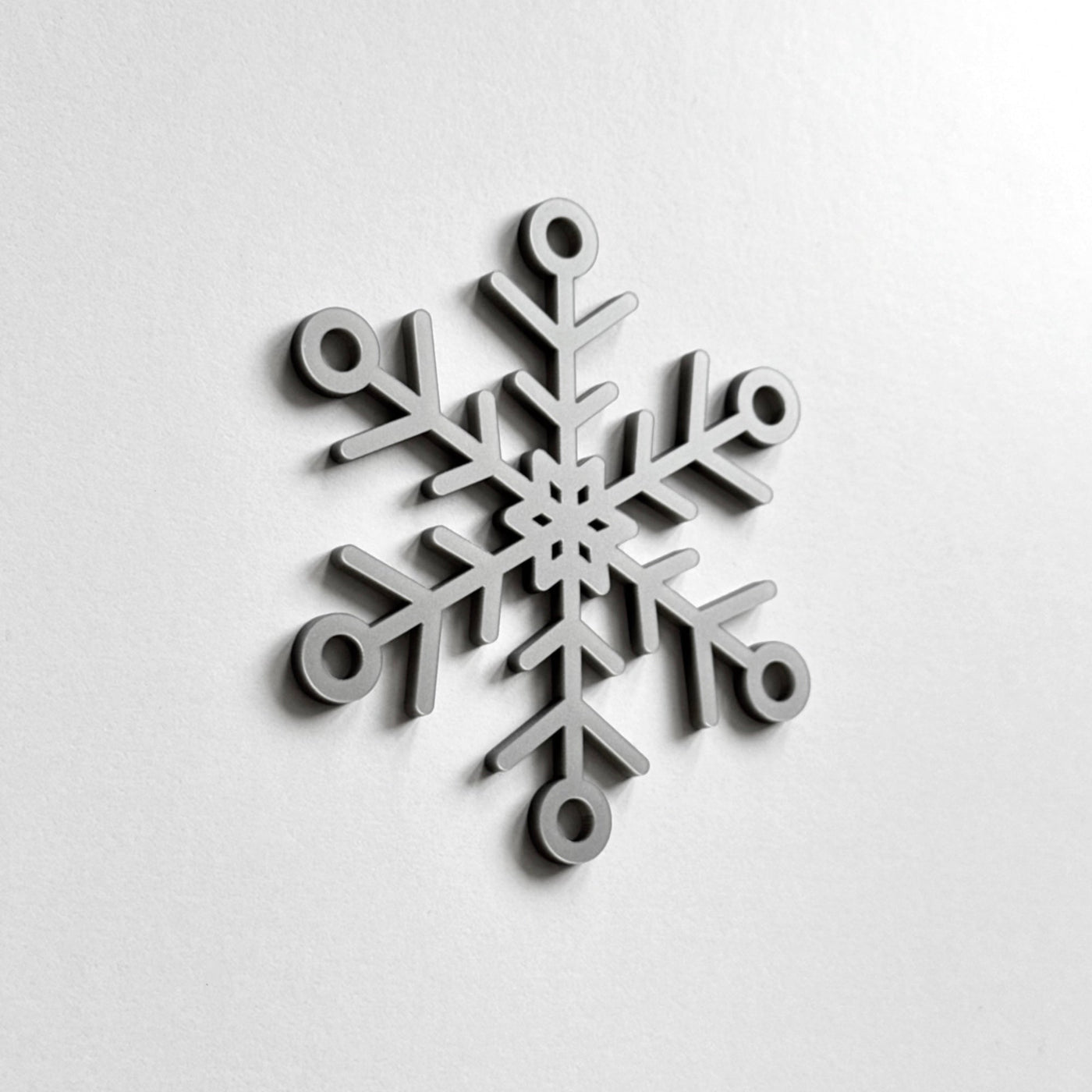 A black and white image of a snowflake.